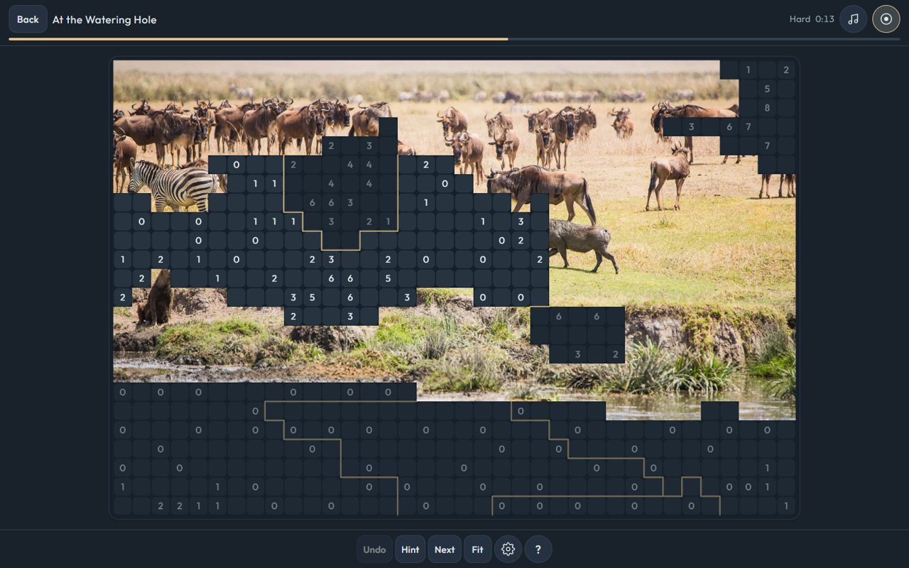 Wildpuzz on a computer, a puzzle grid blooming into a wildlife photograph